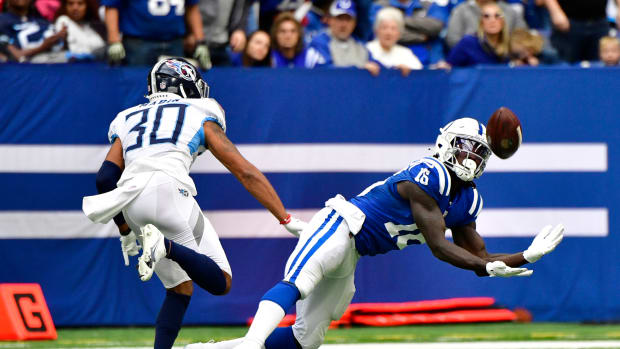 Oct 31, 2021; Indianapolis, Indiana, USA; Indianapolis Colts wide receiver Ashton Dulin (16) misses a long pass in from to Tennessee Titans cornerback Greg Mabin (30) during the second half at Lucas Oil Stadium. Titans won 34-31.